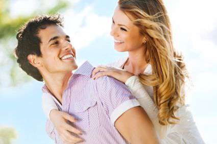 Embraced couple enjoying in a sunny day.
